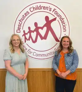 Every Child Central Oregon leadership embrace the nonprofit’s new partnership with Deschutes Children’s Foundation. 